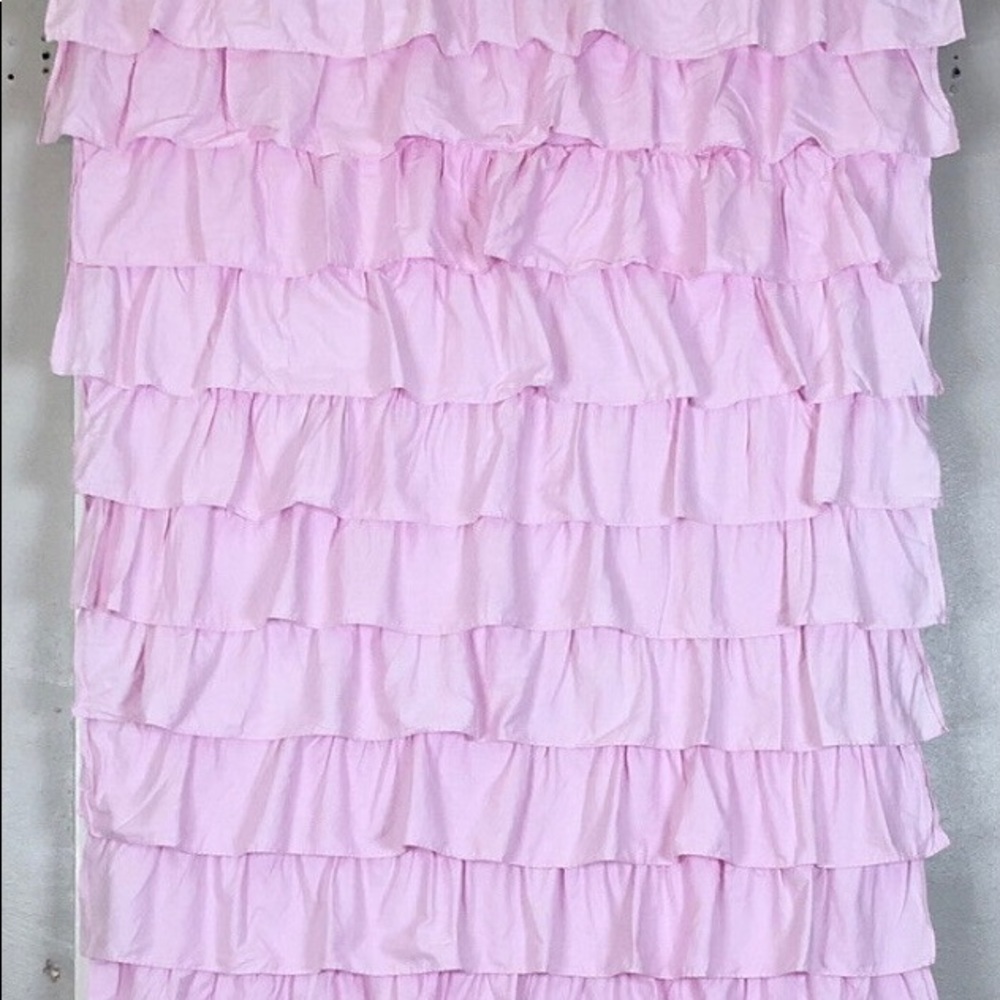 Pottery Barn Kids pink ruffle black out curtains.
44"x63" set of three